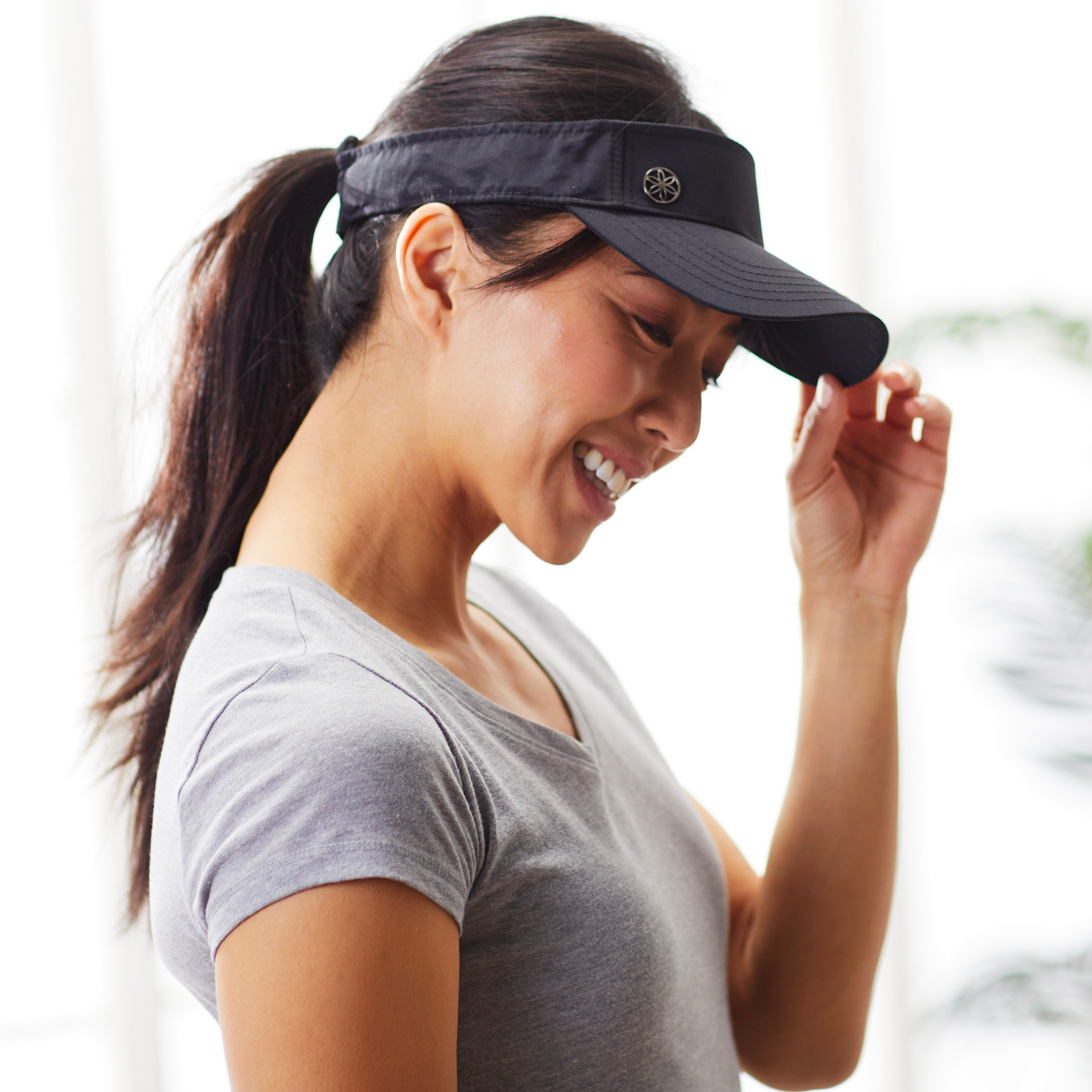 Woman wearing black Classic Fitness Visor